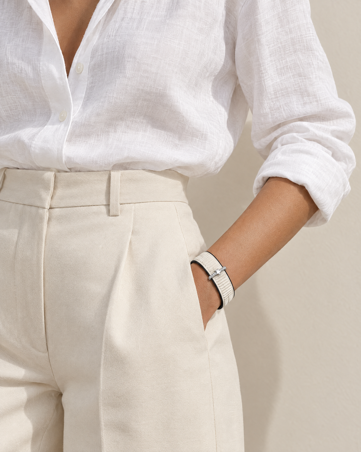 Light knit band on a wrist with a linen shirt