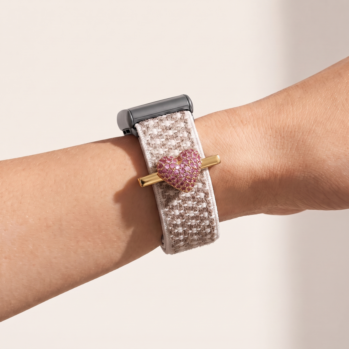 Charm Clip · Pink Heart, gold worn on a knit band