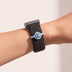 Charm Bar · Evil Eye worn on a knit band